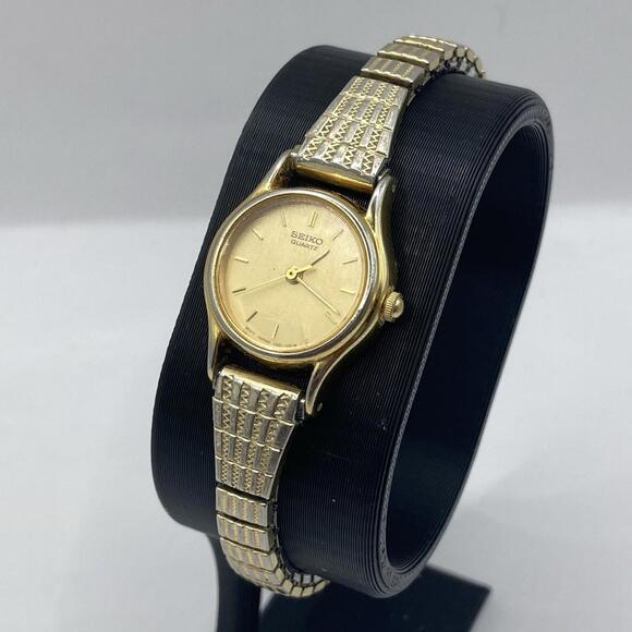 Vintage 1980s Seiko Quartz Gold Tone Ladies Watch Stretch Band 1NO1-OE19 RUNS - Picture 1 of 9